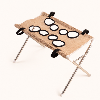 PupCradle dog bathing hammock in Beige on the warm cream website background