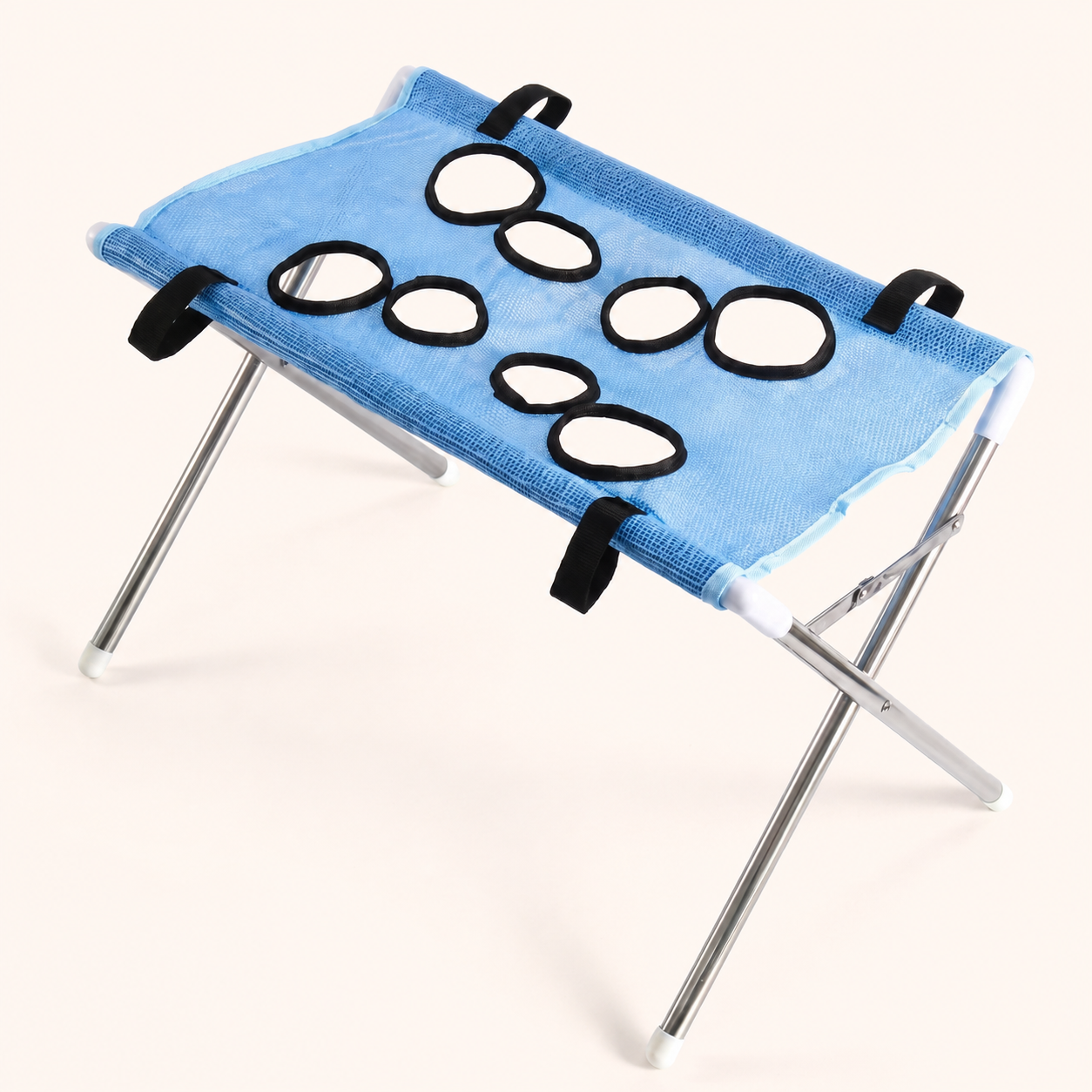 PupCradle dog bathing hammock in Blue on the warm cream website background